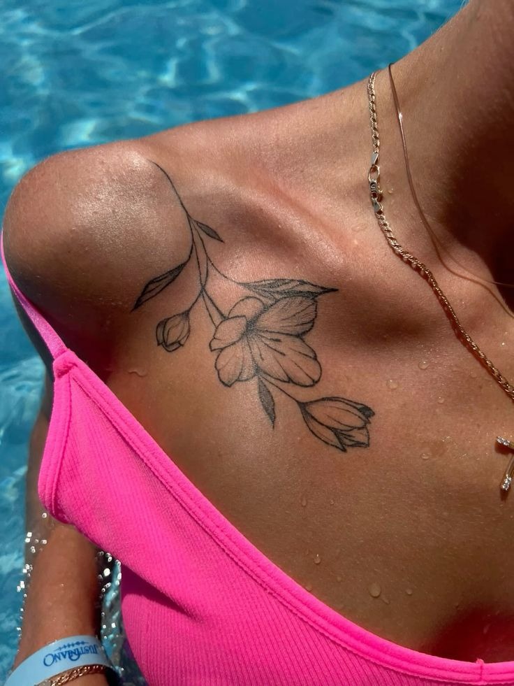 Soft Fine Line Flower on the Shoulder Edge Tattoo Design
