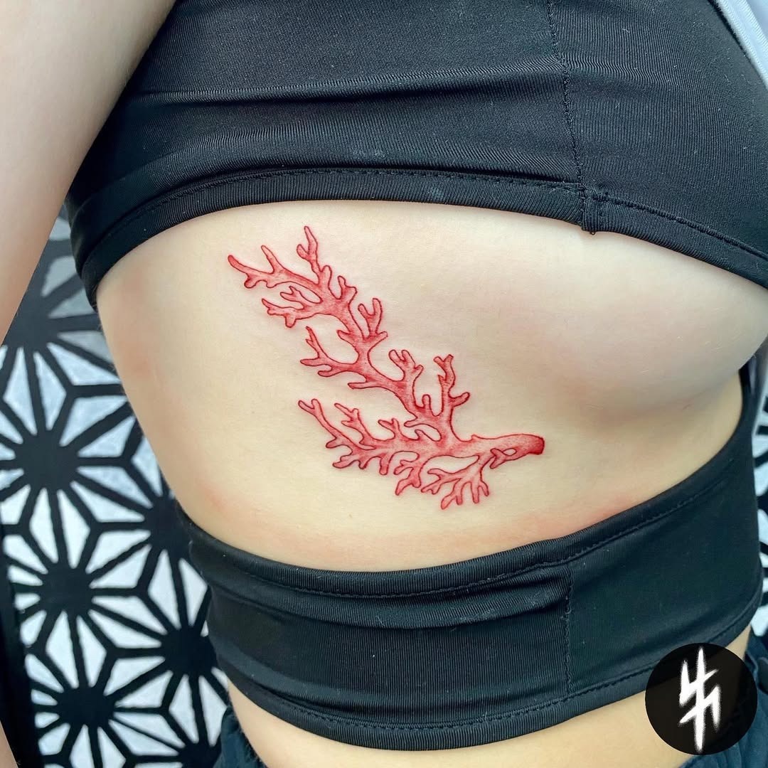 Elegant red coral tattoo on the side Tattoo Design