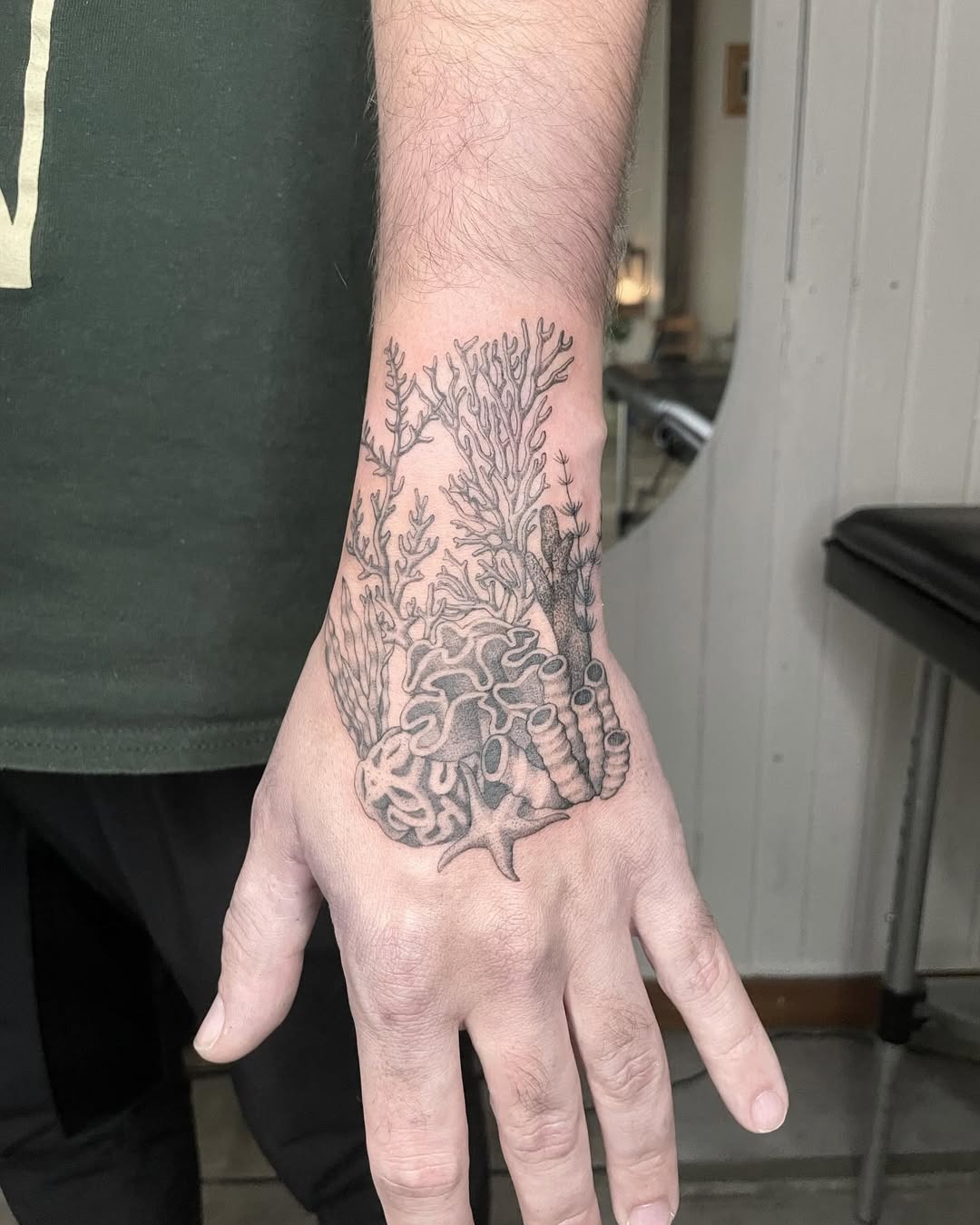 Intricate coral designs on the hand tattoo Tattoo Design
