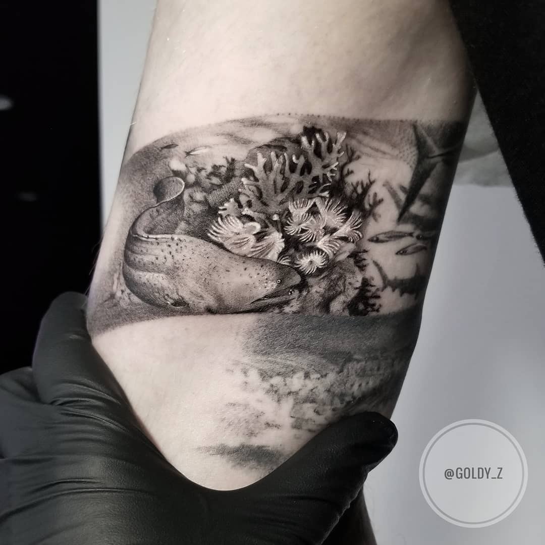 Intricate coral reef tattoo showcasing marine life Tattoo Design