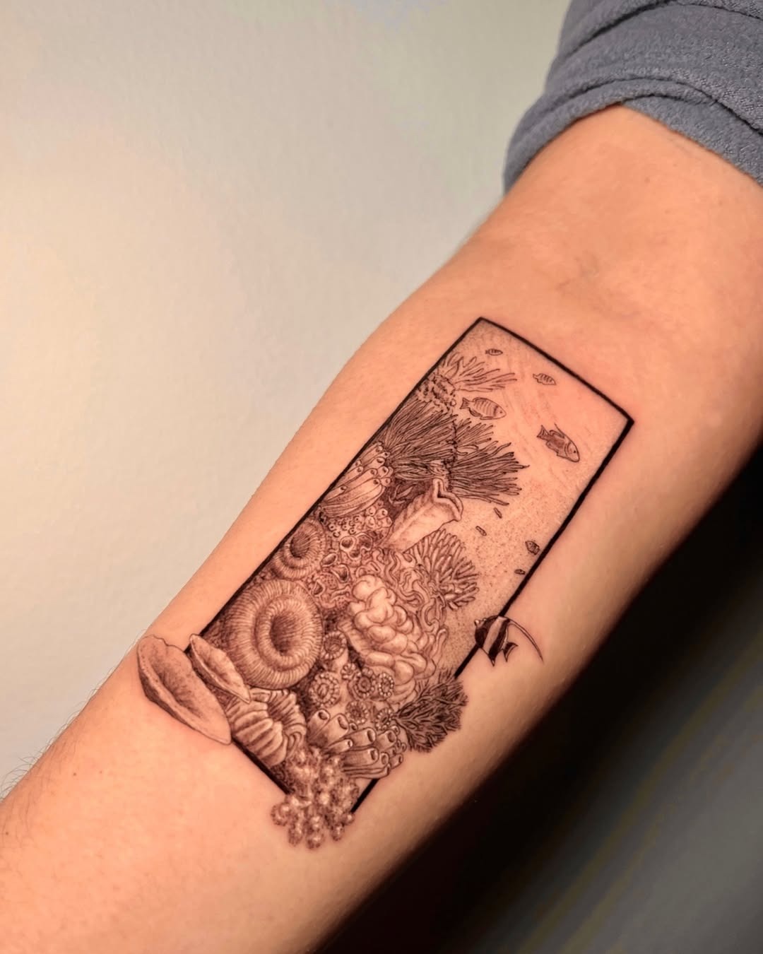 Intricate underwater scene captured in tattoo form Tattoo Design