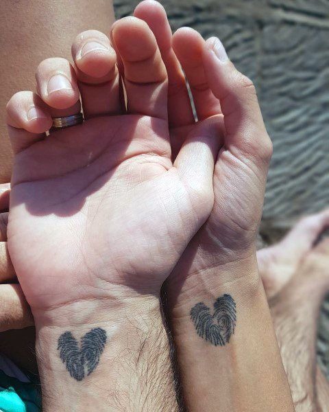 Fingerprint tattoos are an incredibly personal and unique way to symbolize the bond between two people.