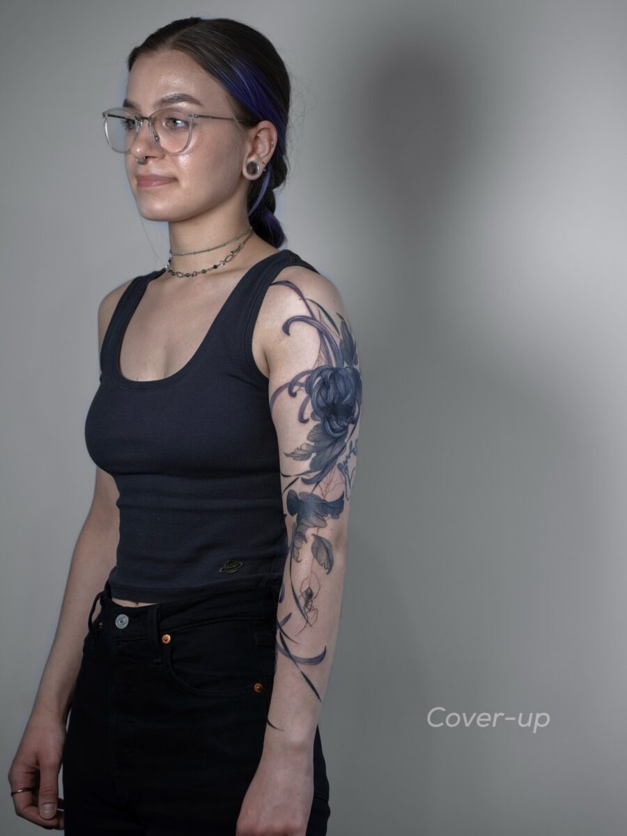 Elegant floral cover-up tattoo design showcased Tattoo Design