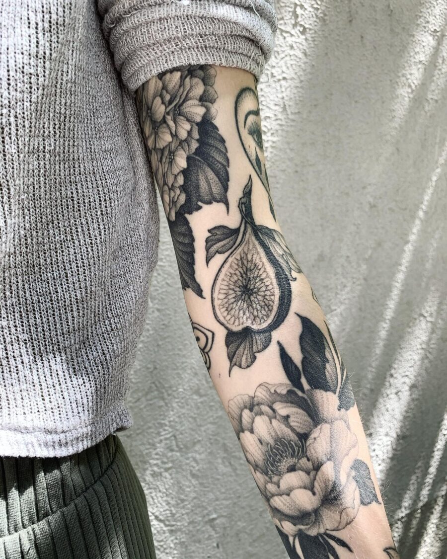 Intricate floral cover-up tattoo on arm Tattoo Design