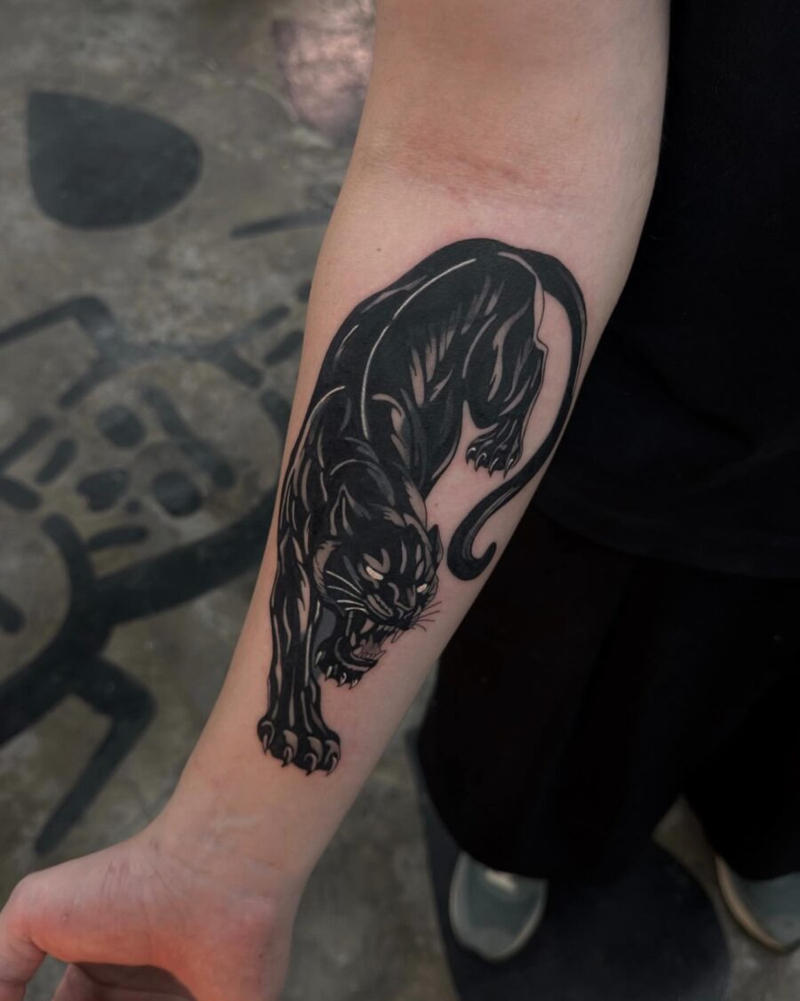 Striking black panther tattoo design on arm Tattoo Design