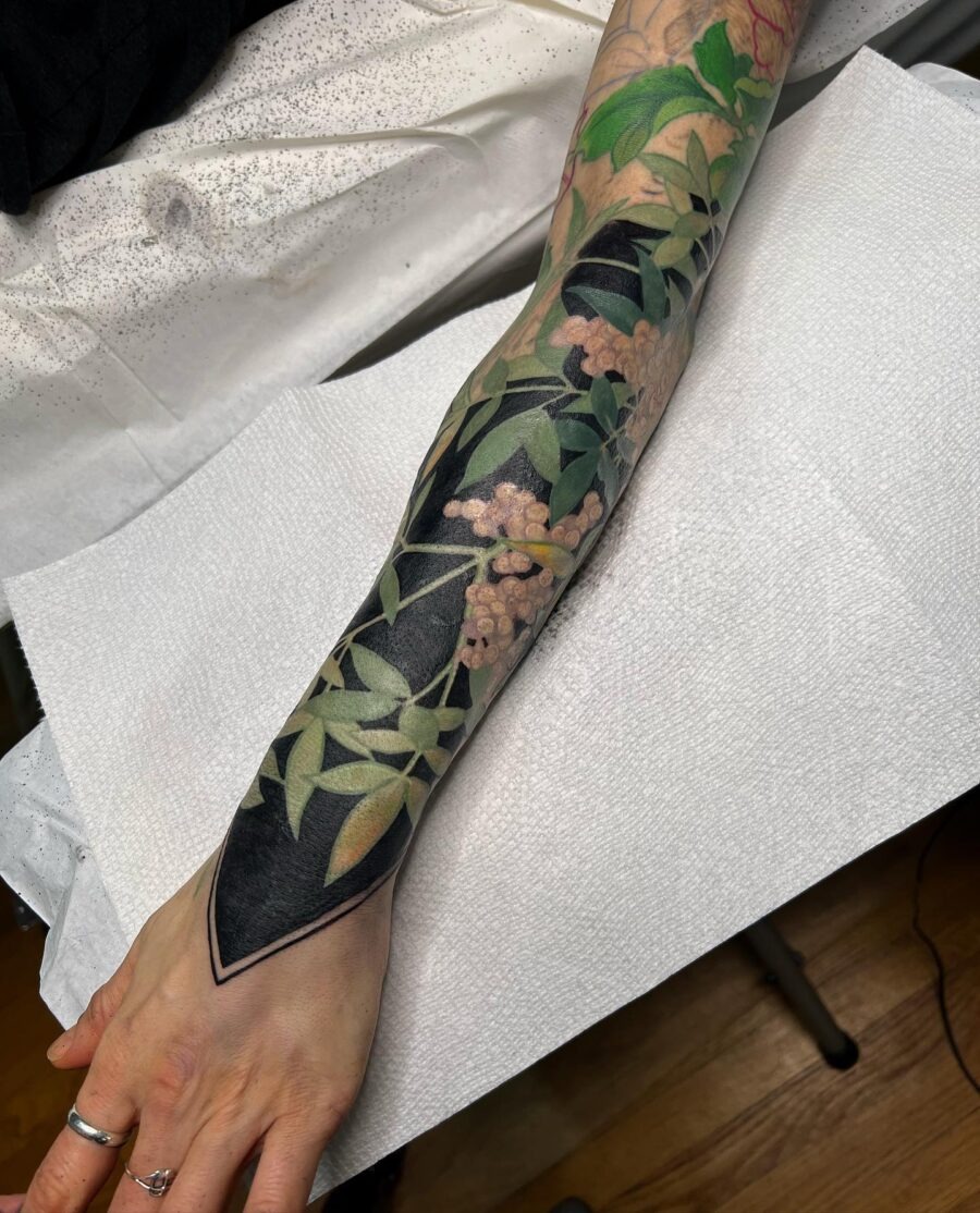 Stunning floral cover-up tattoo on forearm Tattoo Design