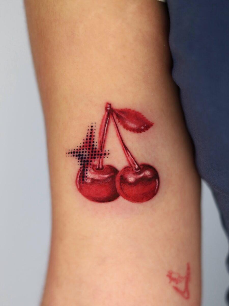 Vibrant Cherry Tattoo with Bold Detailing Tattoo Design