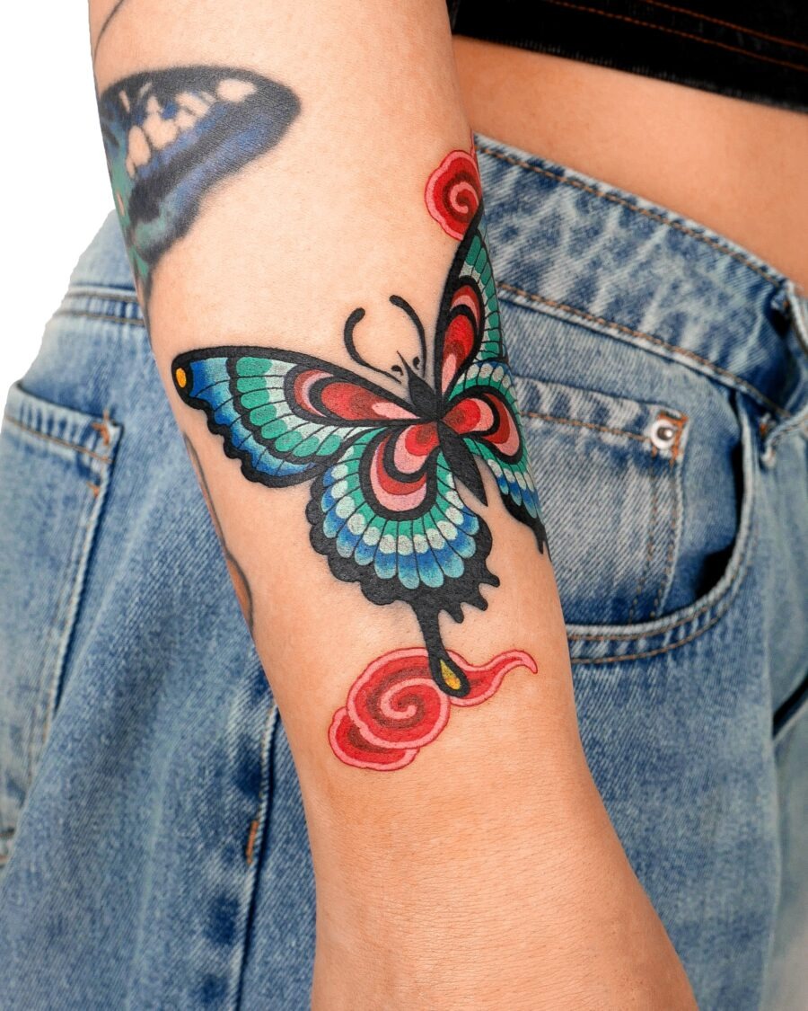 Vivid butterfly tattoo with swirling accents Tattoo Design