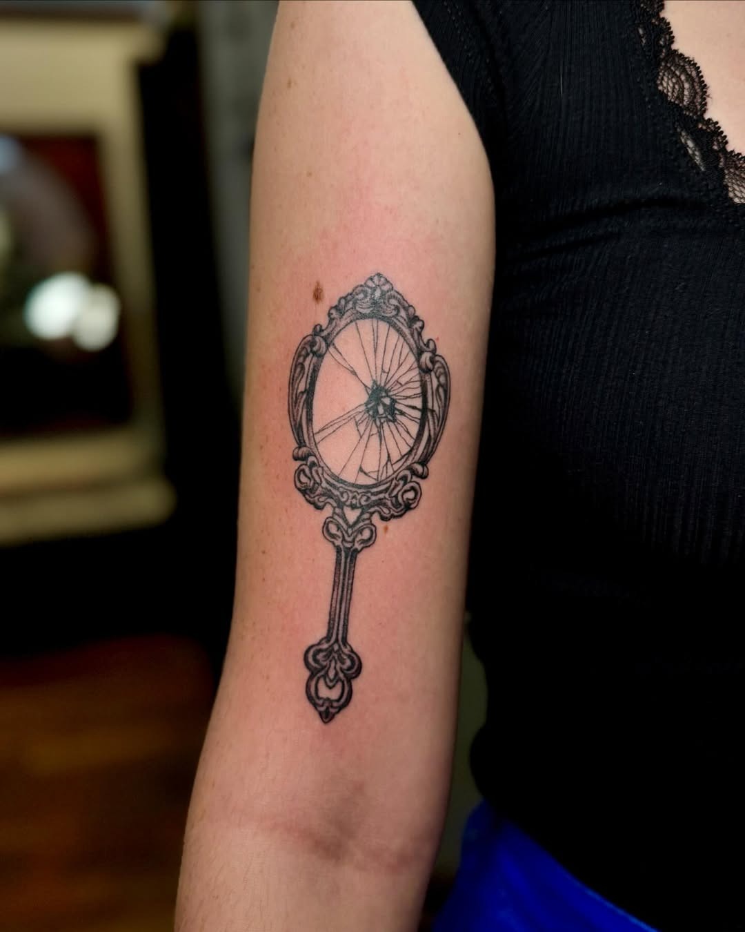 Elegant cracked mirror tattoo with vintage charm Tattoo Design