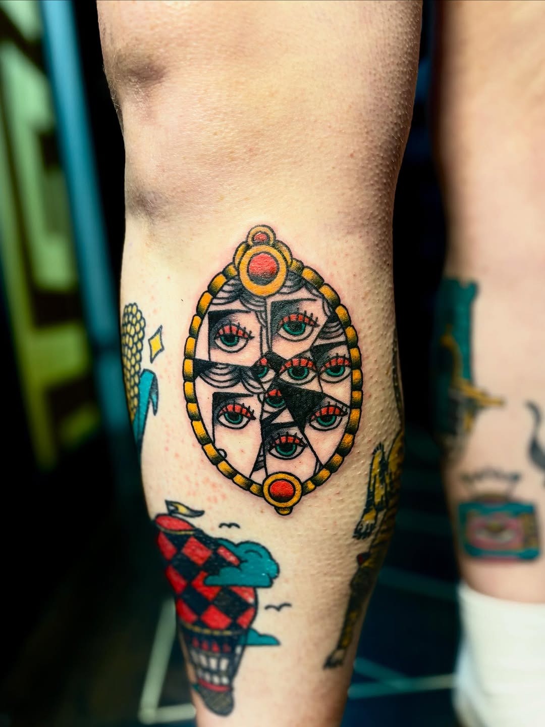 Unique cracked mirror tattoo design featuring multiple eyes Tattoo Design