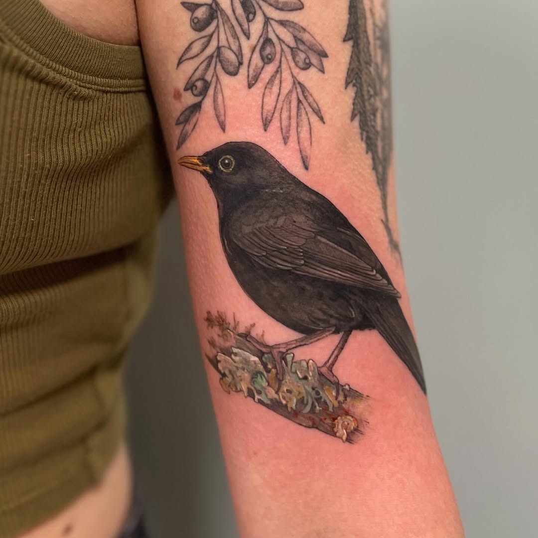 Beautiful blackbird tattoo on the forearm Tattoo Design