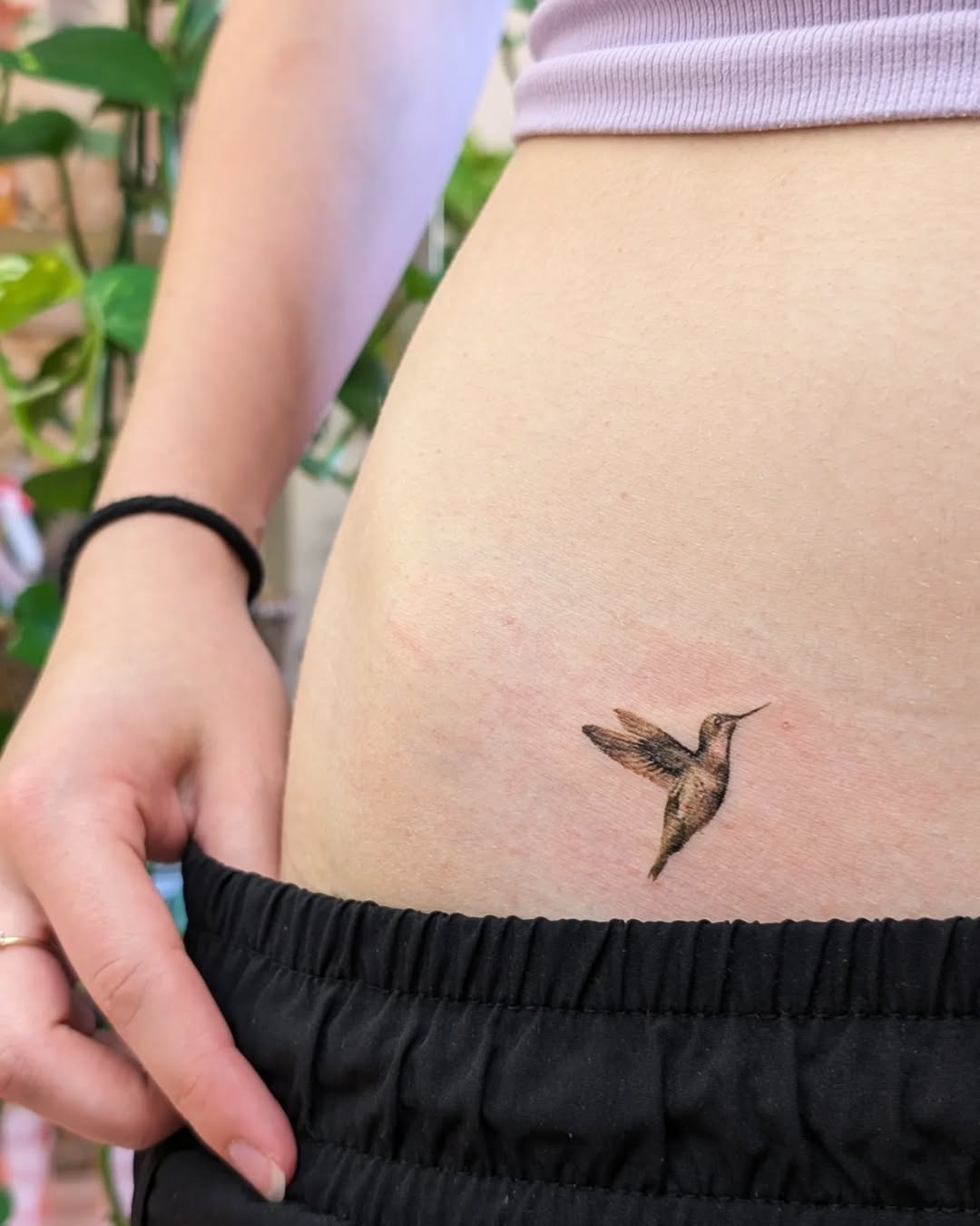 Delicate hummingbird tattoo on side rib Tattoo Design