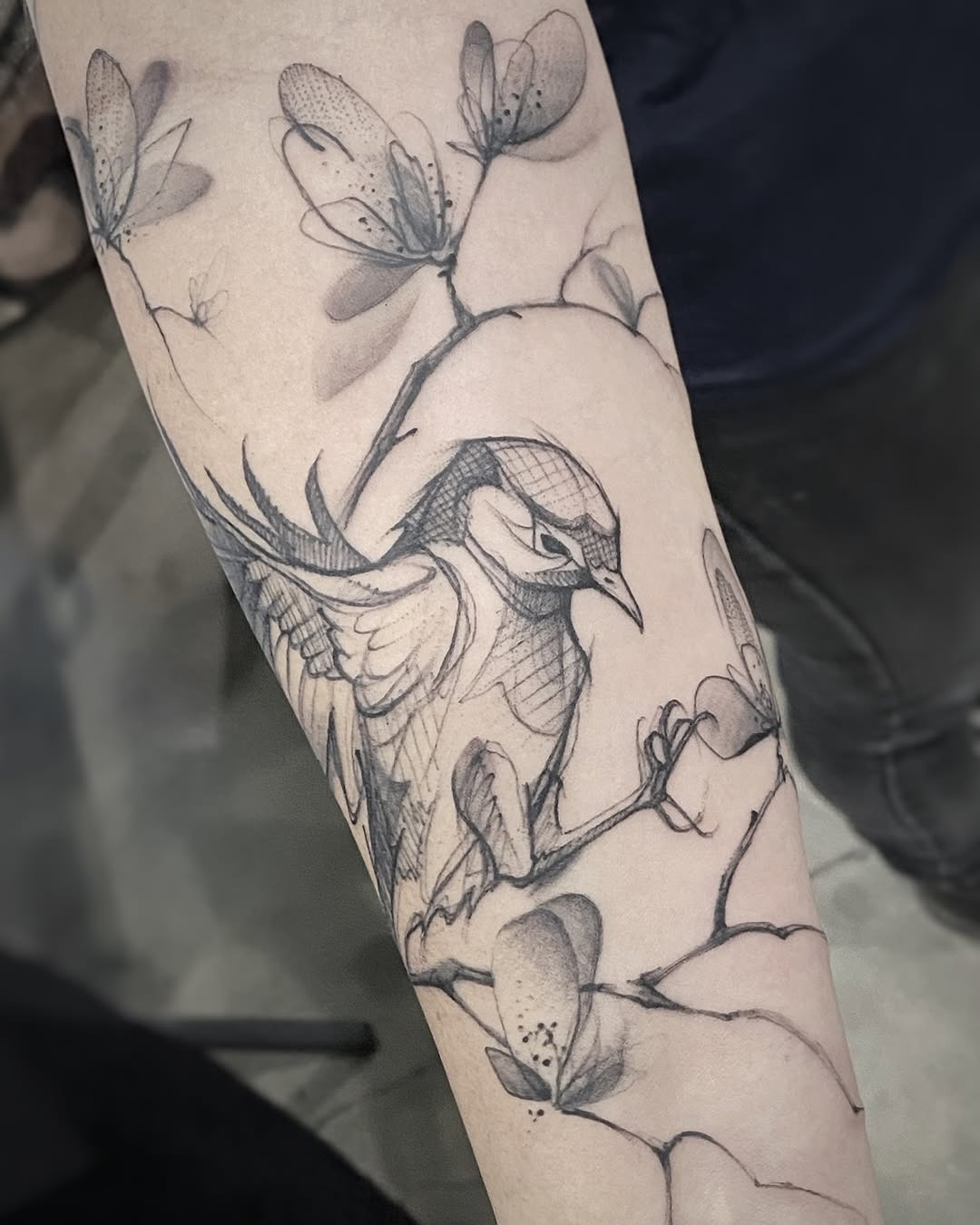 Elegant bird tattoo with floral elements Tattoo Design