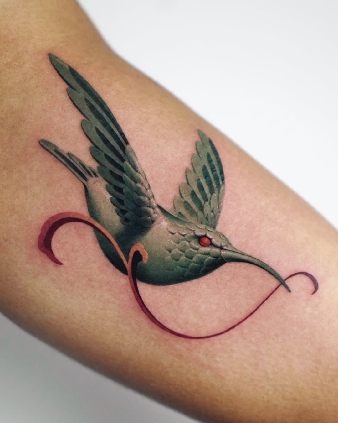Elegant hummingbird soaring with vivid details Tattoo Design