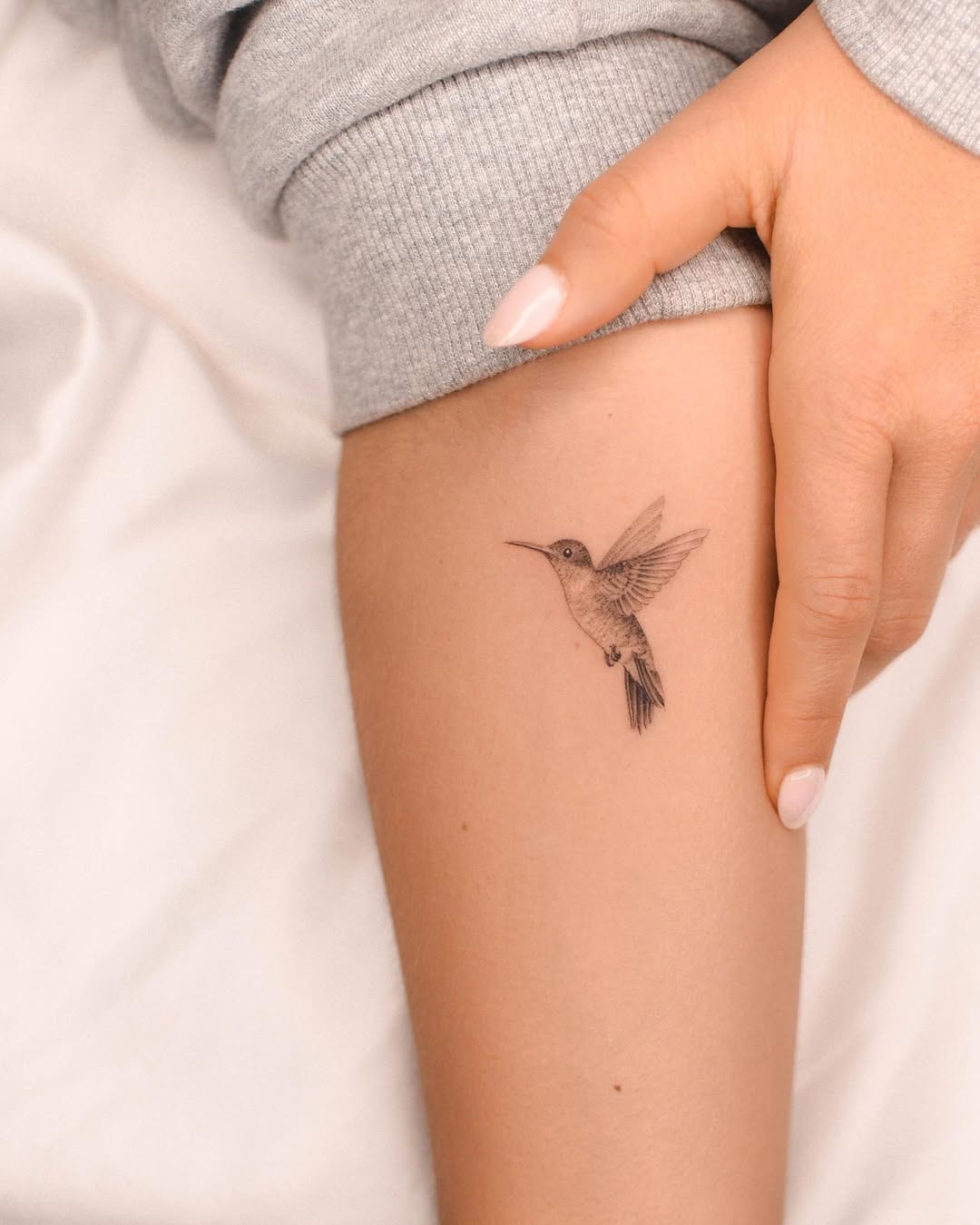 Elegant hummingbird tattoo in fine detail Tattoo Design