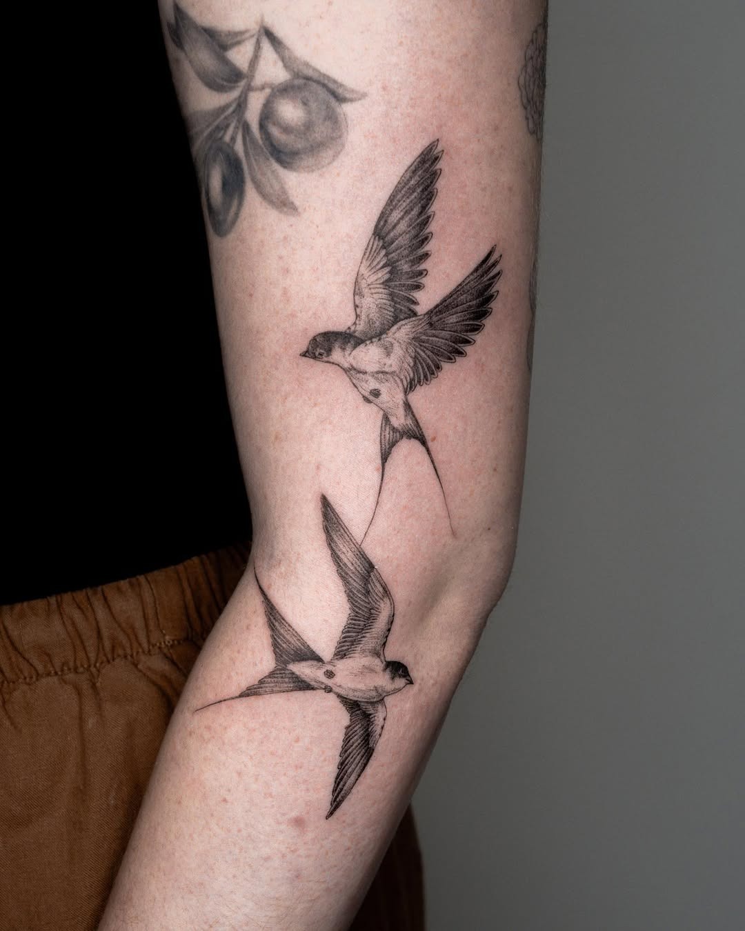 Elegant swallows in mid-flight tattoo design Tattoo Design