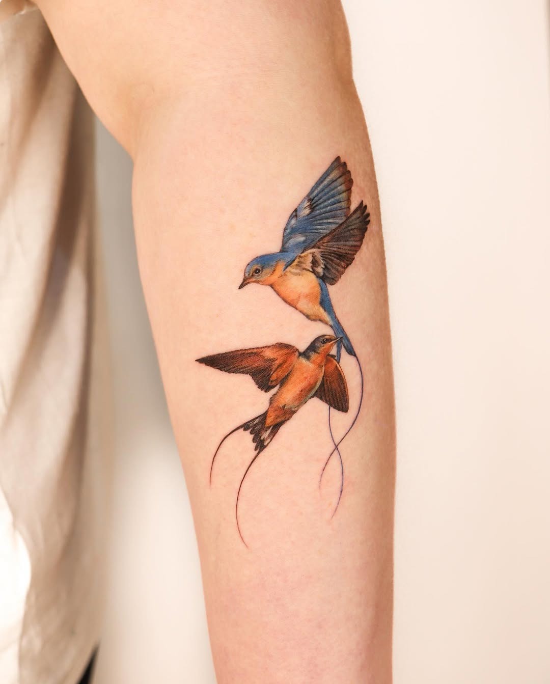 Stunning pair of vibrantly colored birds tattoo Tattoo Design
