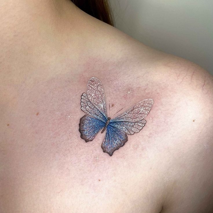 Blue Glitter-Style Butterfly Tattoo, a tattoo design rendered in delicate fine-line.