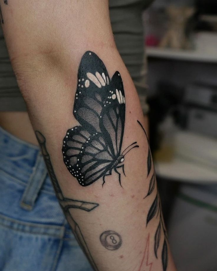 Dark Butterfly Arm Tattoo, a tattoo design rendered in clean detailed linework.