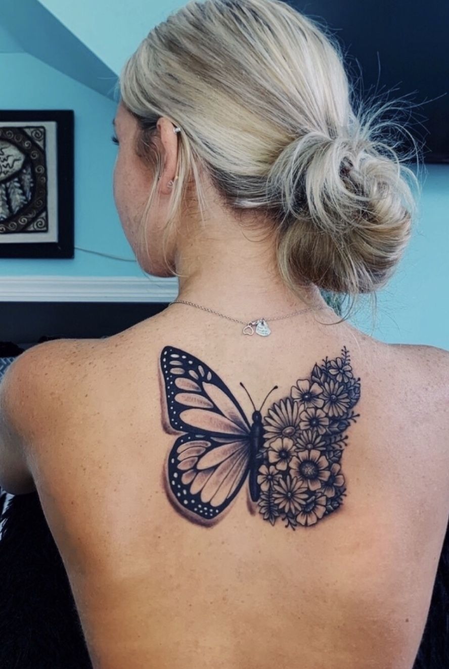 Large Butterfly and Flower Back Tattoo, a tattoo design rendered in clean detailed linework.