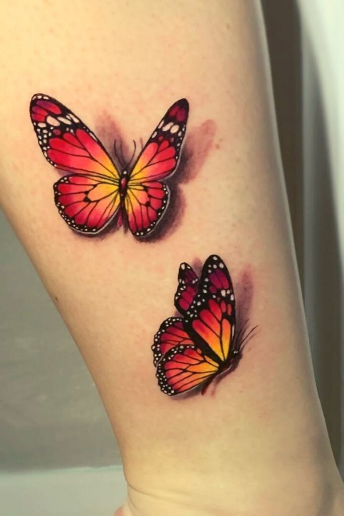 Red and Yellow Butterfly Pair Tattoo, a tattoo design rendered in bold for the arm.