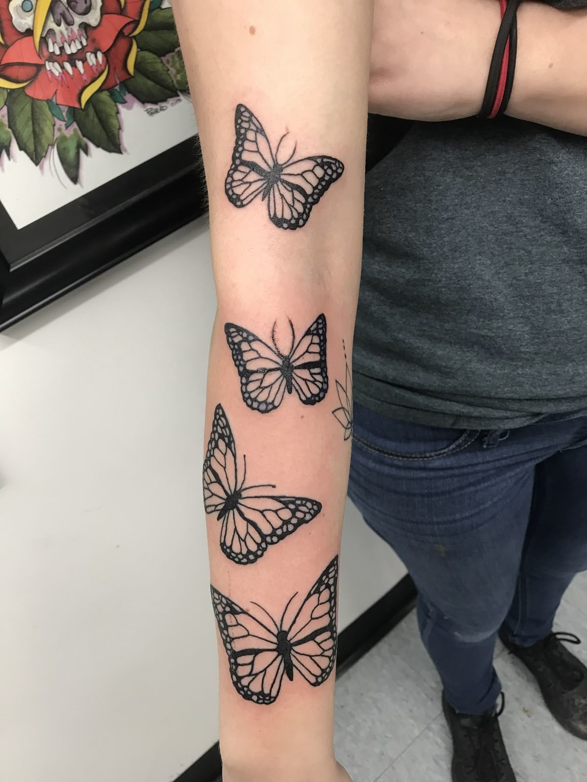 Simple Butterfly Forearm Cluster Tattoo, a tattoo design rendered in bold.