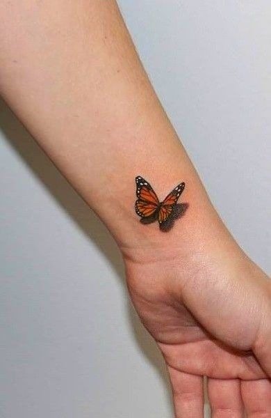 Tiny Monarch Wrist Tattoo, a tattoo design rendered in clean detailed linework.