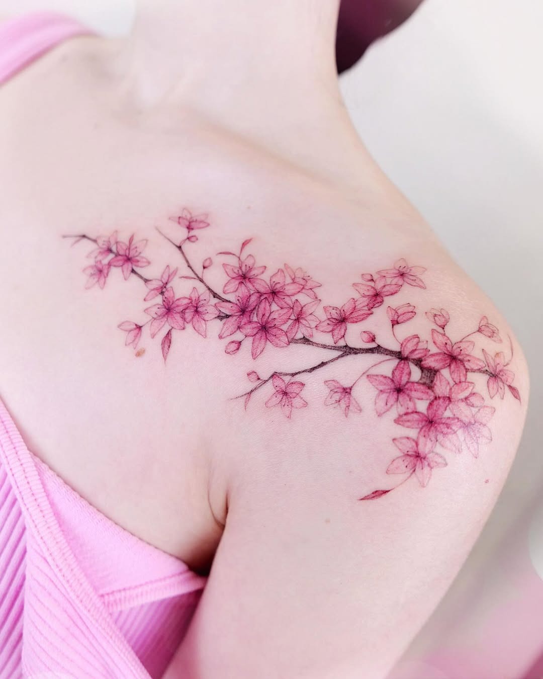 Delicate cherry blossom tattoo on shoulder. Tattoo Design