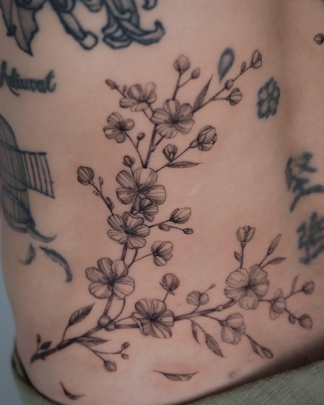 Elegant Cherry Blossom Tattoo Embracing Skin Tattoo Design