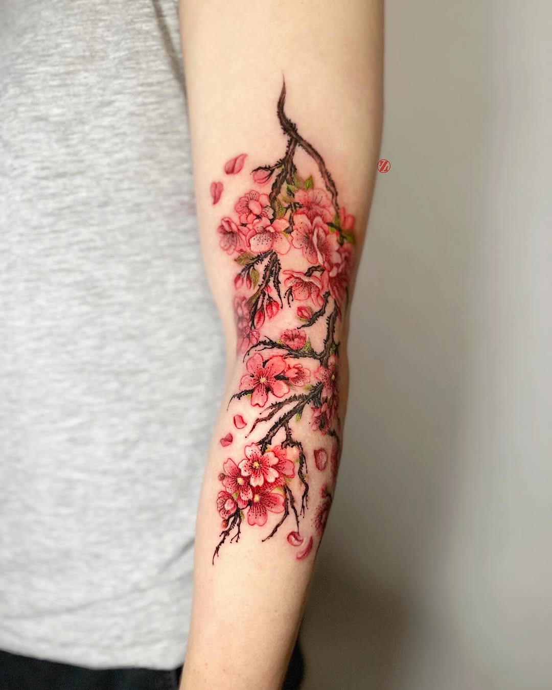 Elegant cherry blossom tattoo on arm Tattoo Design