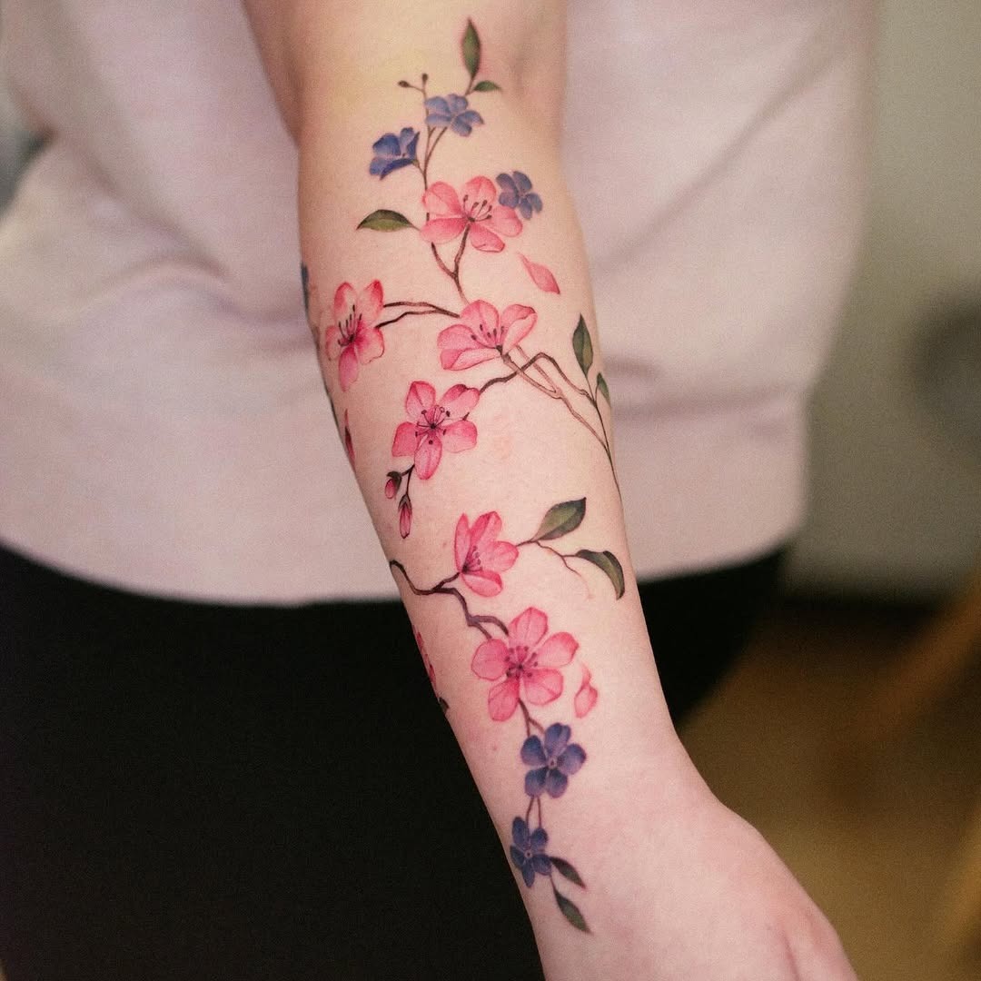 Elegant cherry blossom tattoo on forearm Tattoo Design