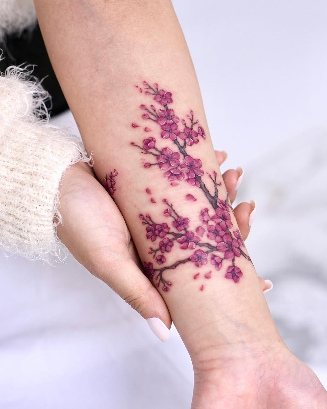 Elegant cherry blossom tattoo on forearm Tattoo Design