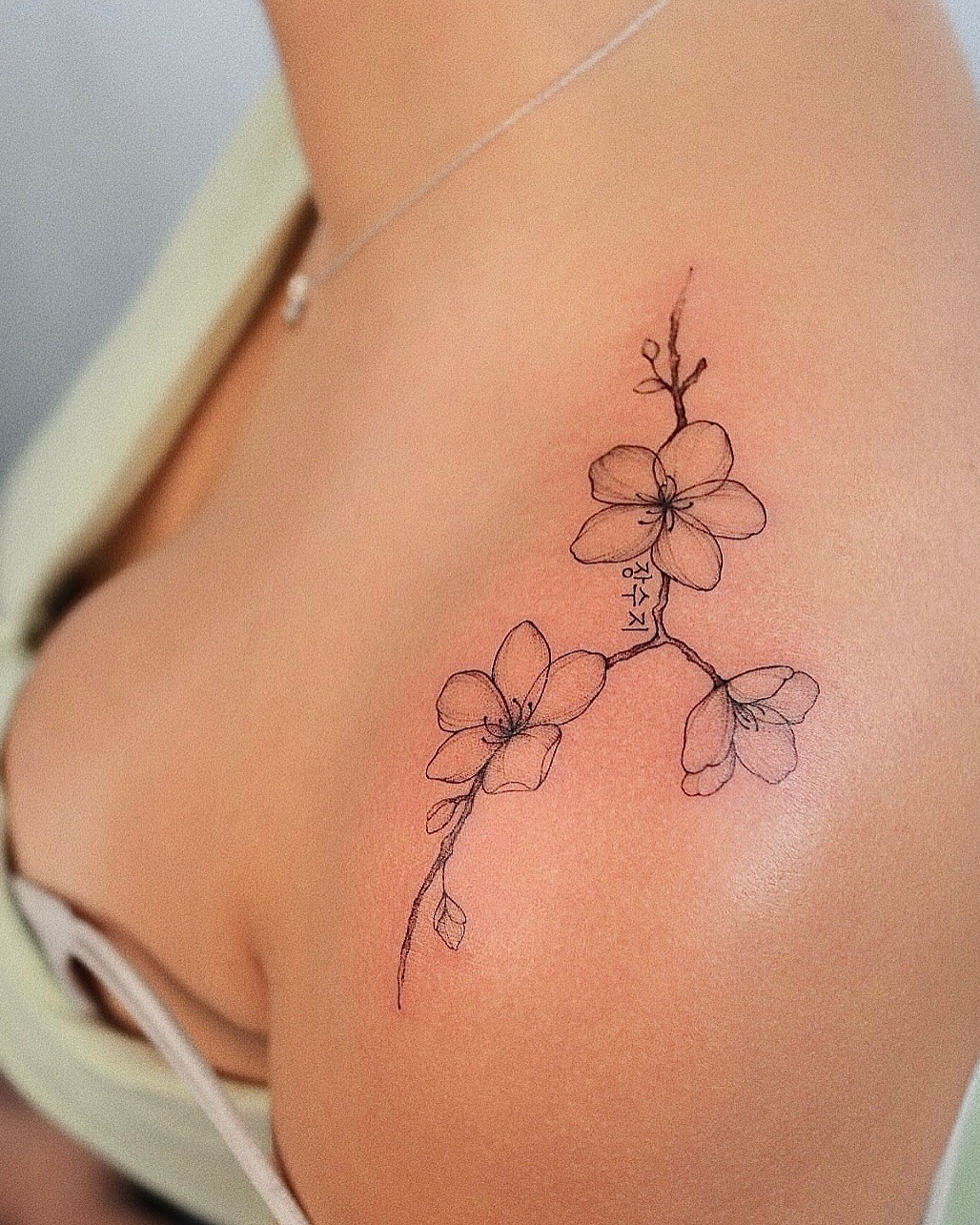 Elegant cherry blossom tattoo on shoulder Tattoo Design