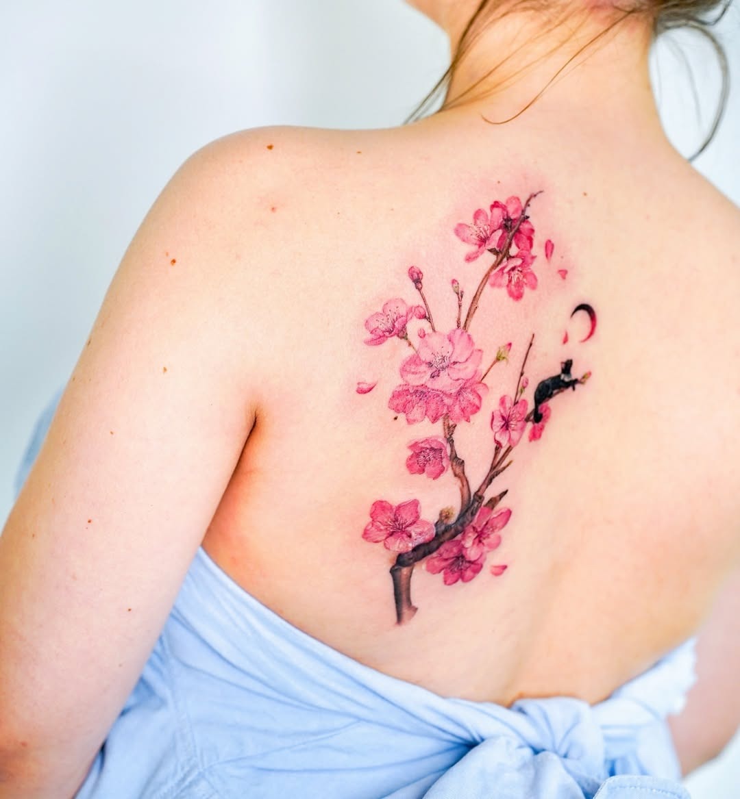 Elegant cherry blossom tattoo on the back Tattoo Design