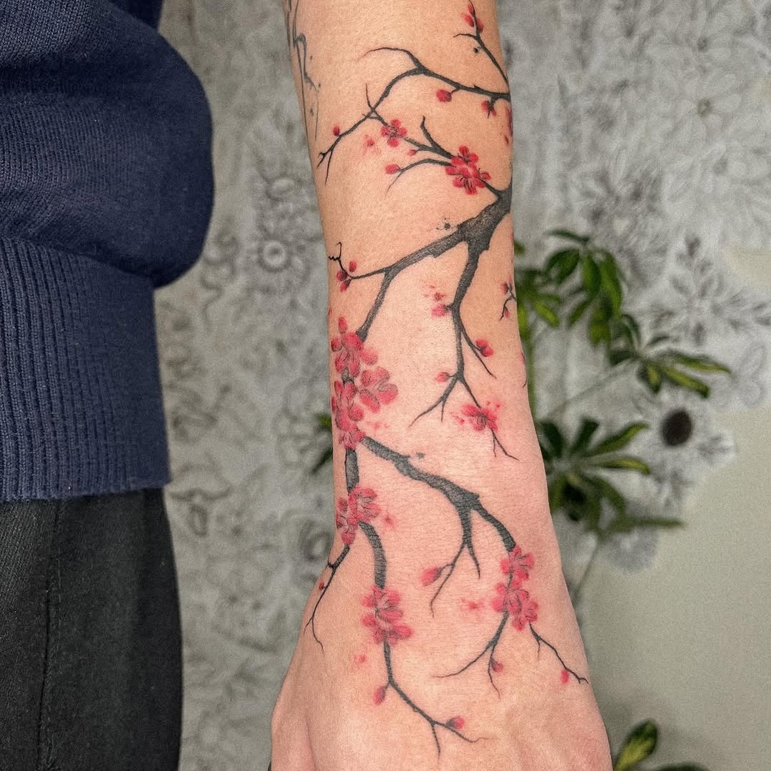 Elegant Cherry Blossom Tattoo on the Forearm Tattoo Design