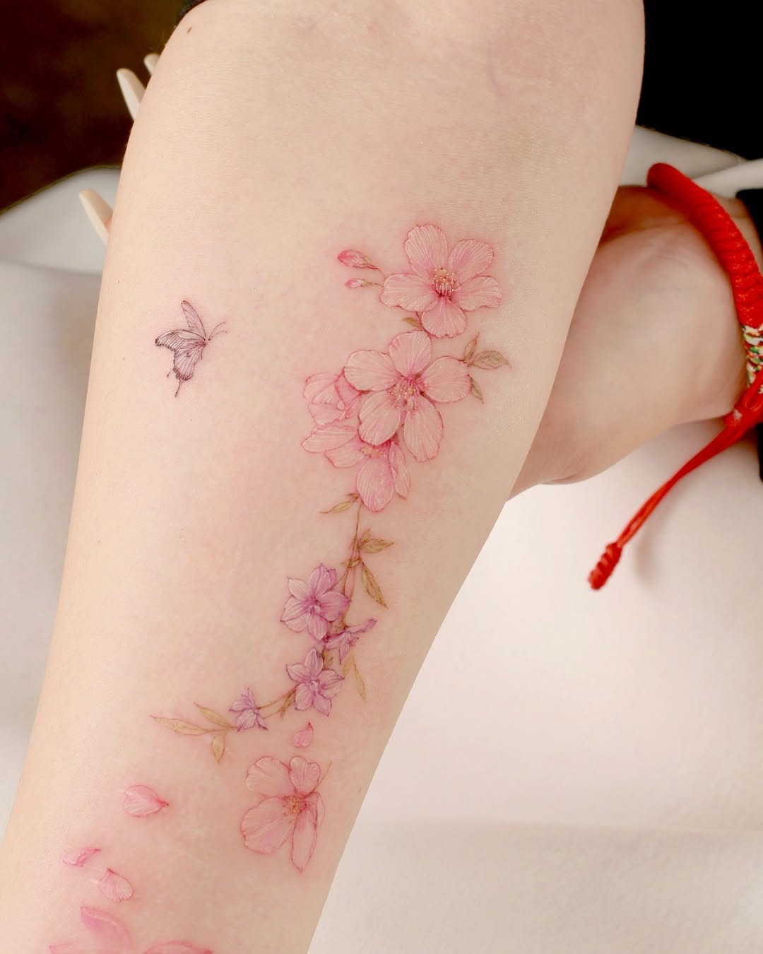 Elegant cherry blossom tattoo with soft details Tattoo Design