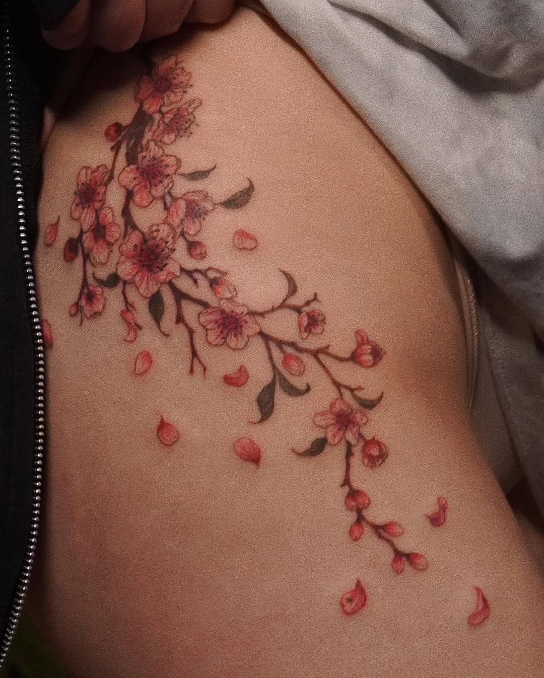 Elegant cherry blossoms cascading on the skin Tattoo Design