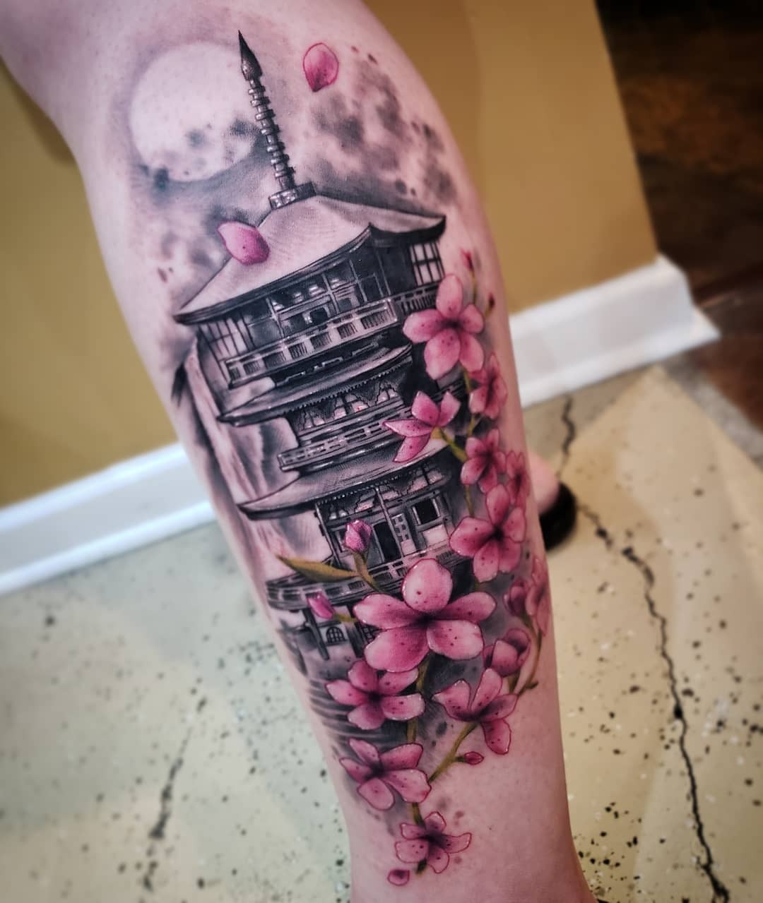 Elegant cherry blossoms with traditional Japanese pagoda Tattoo Design