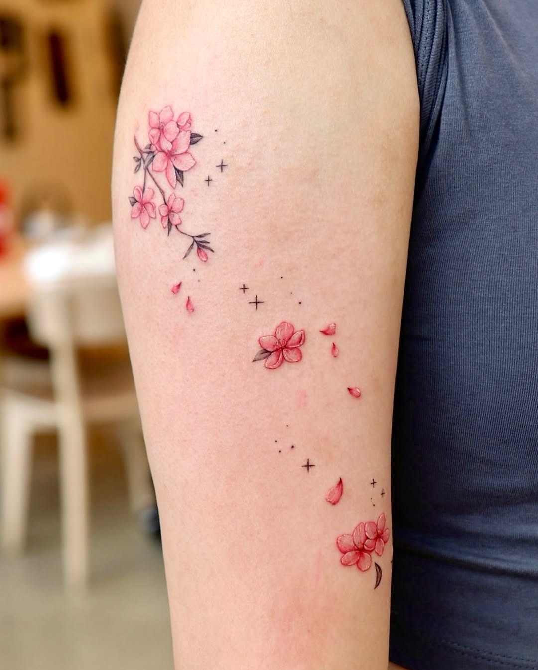 Serene cherry blossom tattoo with delicate petals Tattoo Design