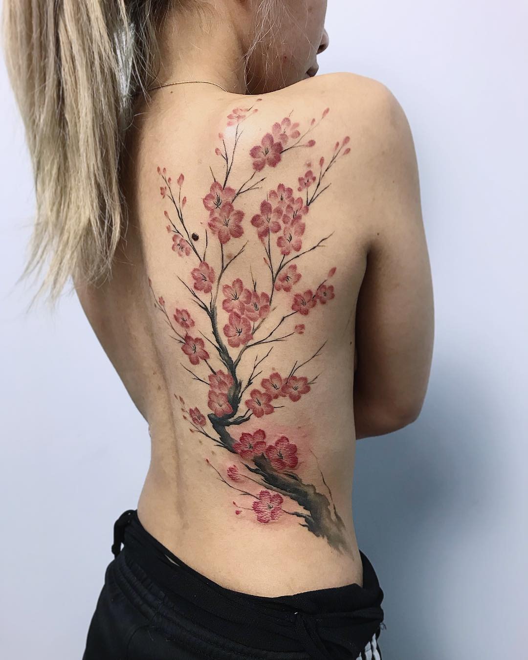 Stunning Cherry Blossom Tattoo on Back Tattoo Design