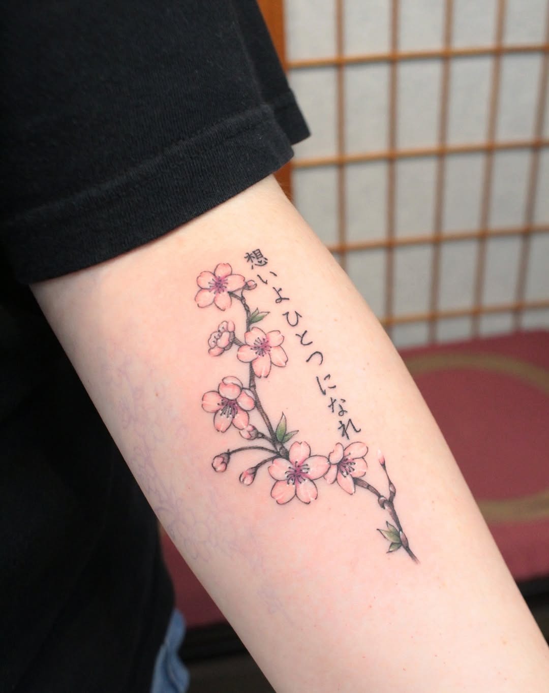 Stunning cherry blossom tattoo with Japanese text Tattoo Design