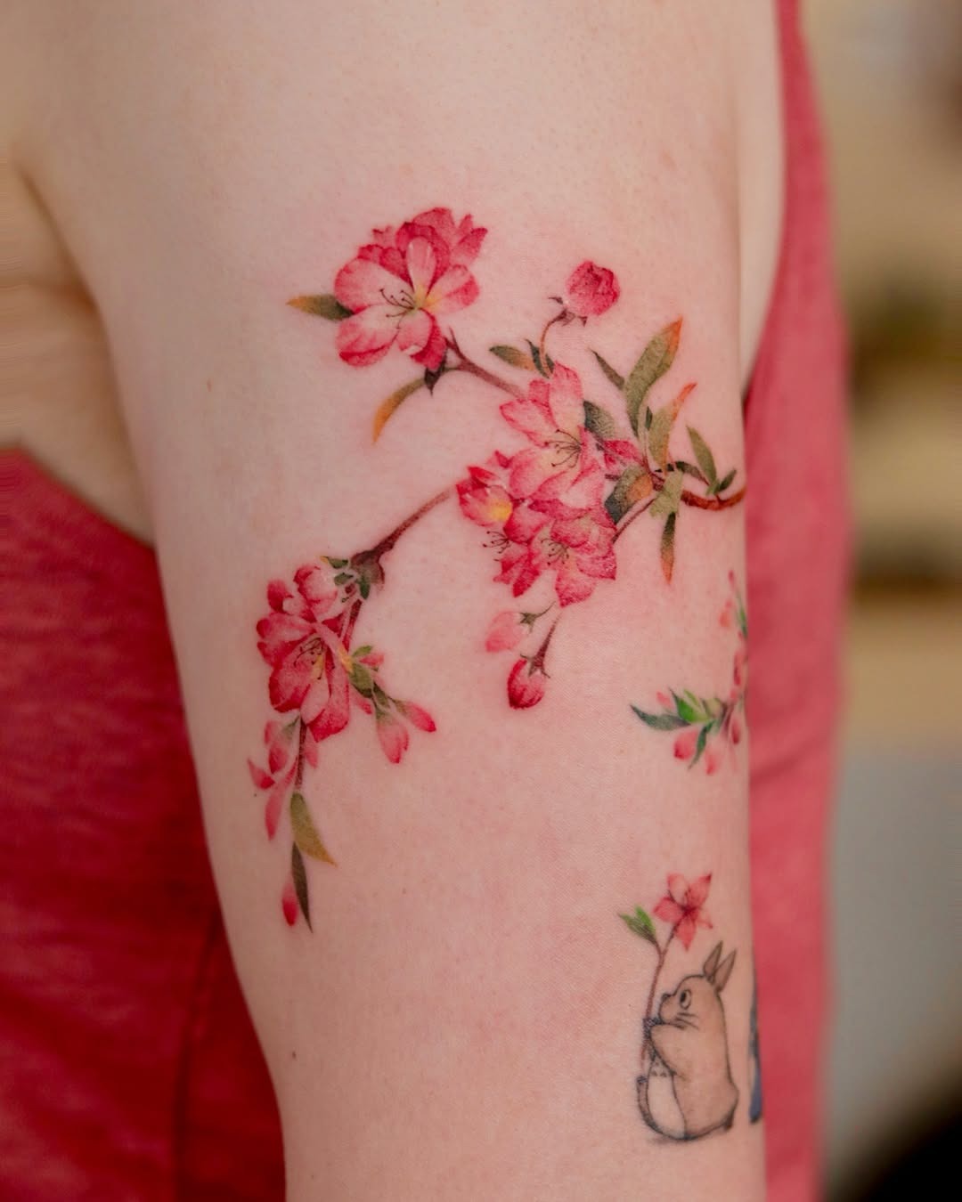 Stunning cherry blossoms inked in vibrant colors Tattoo Design