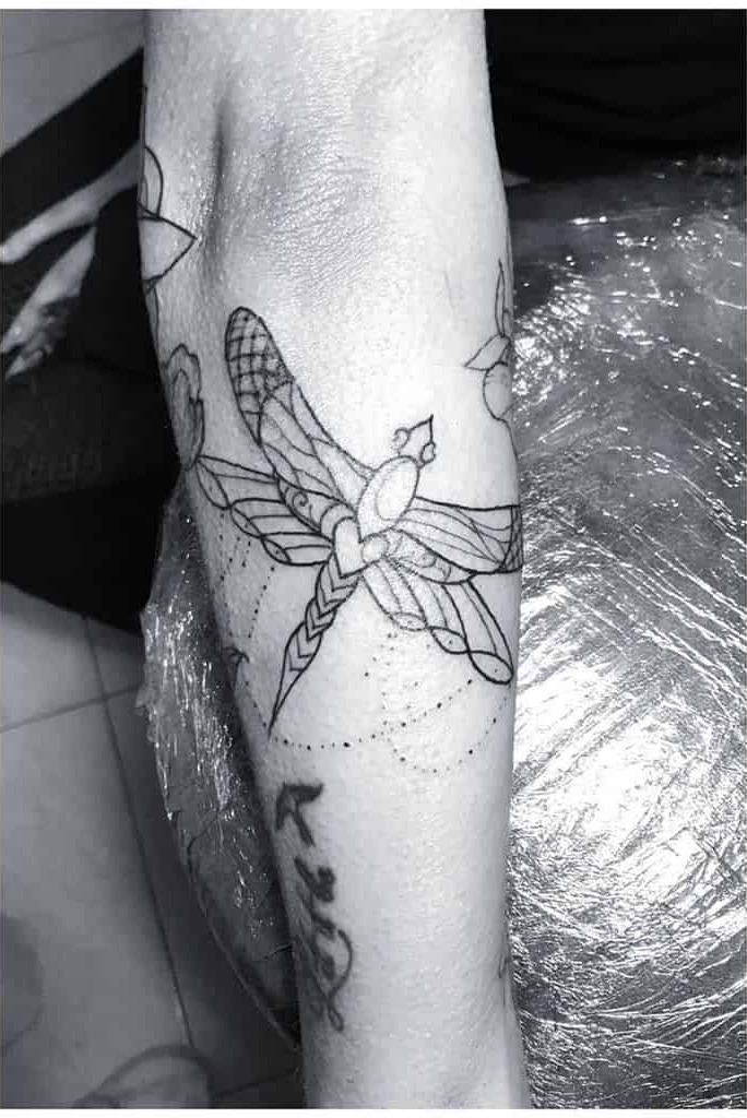 Dragonfly Tattoo Idea with a Triangular Center Tattoo Design