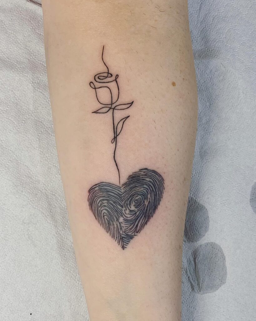Fingerprint Heart with Crossed Roses Tattoo Design