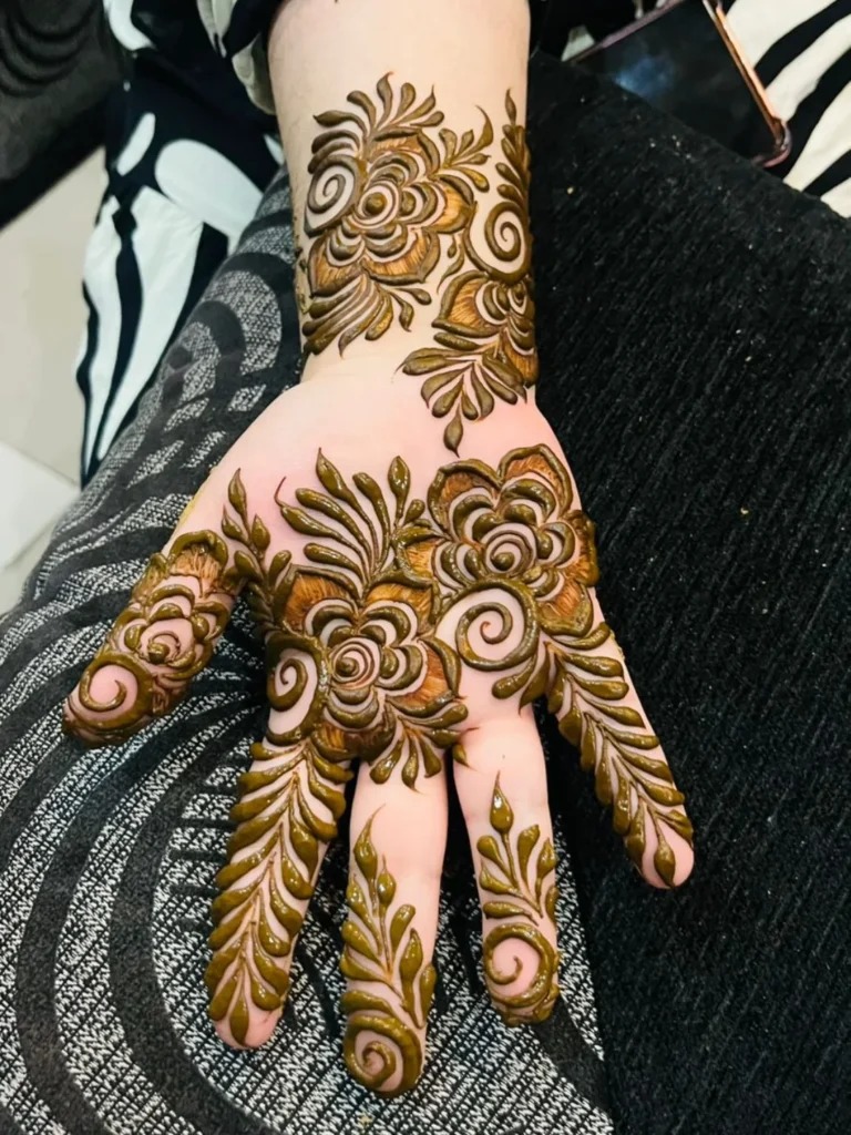 Bold Floral Henna with Leafy Accents Tattoo Design