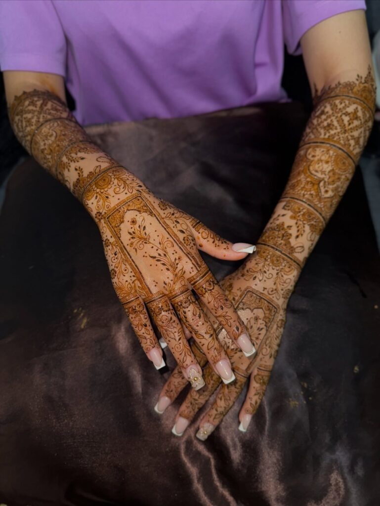 Elegant Full Arm Mehndi with Framed Panels Tattoo Design