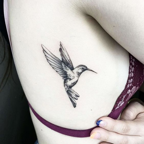 Determined Small Hummingbird Tattoo Design on Ribcage Tattoo Design