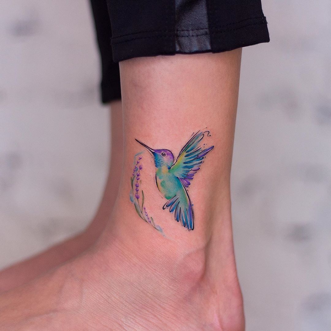 Pastel Hummingbird Tattoos Framed by a Lavender Sprig Tattoo Design
