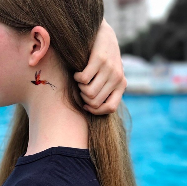 Tiny Black, Orange, and Red Hummingbird Tattoos Tattoo Design