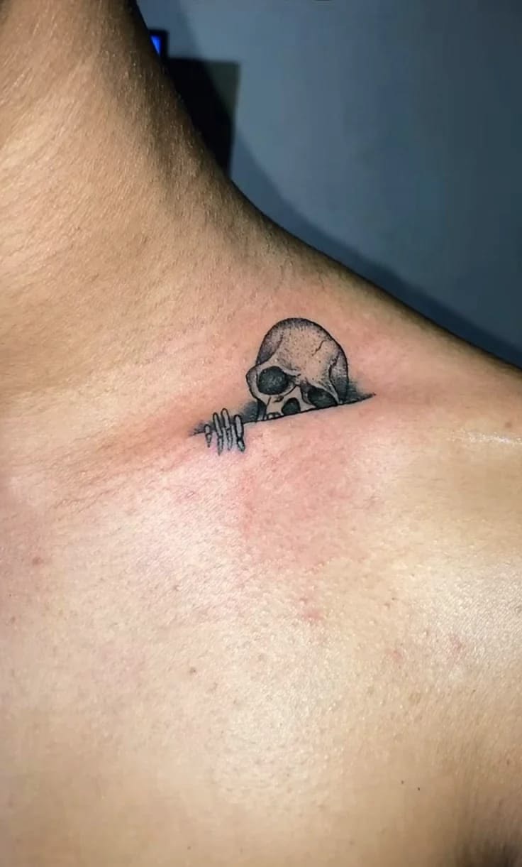Tiny Peeking Skull Neck Tattoo Tattoo Design
